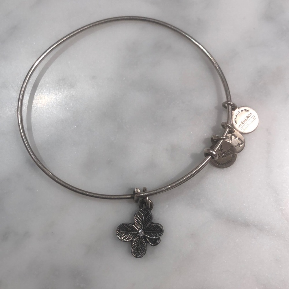 Silver bangle bracelet with clover charm
